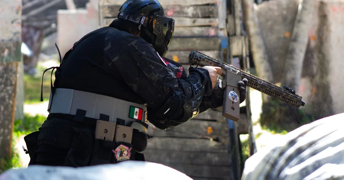 Player in full gear firing a reliable mechanical paintball gun during an outdoor match
