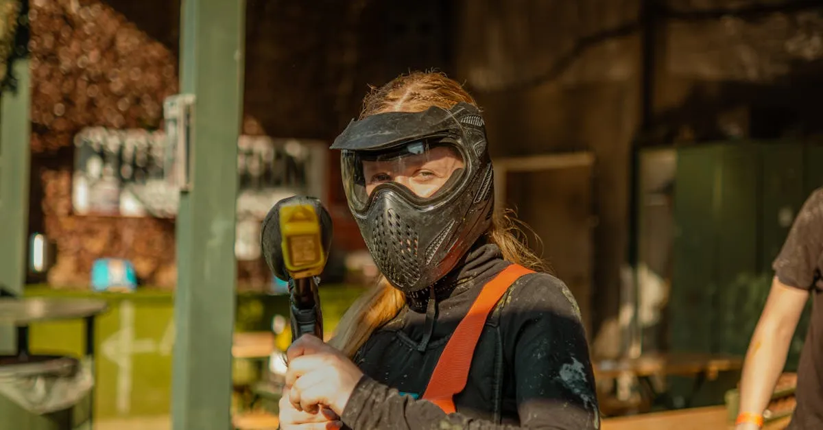 Player in protective gear bracing for a hit to show what paintball impact feels like