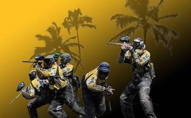 team of paintball players with palm tree background