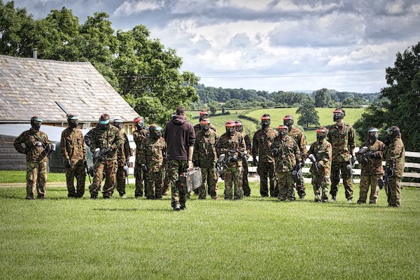 paintballing squad at the field preparing to play