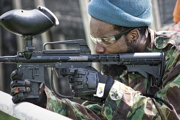 paintball player taking aim on the field
